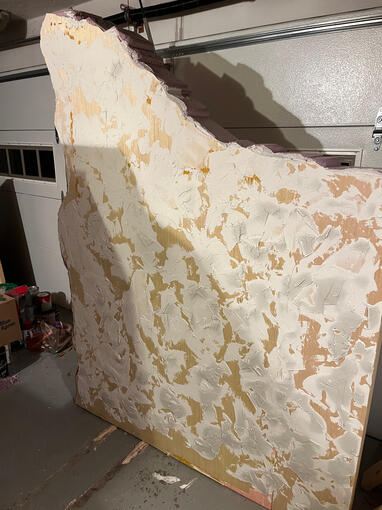 joint compound texturing on stucco/rock wall